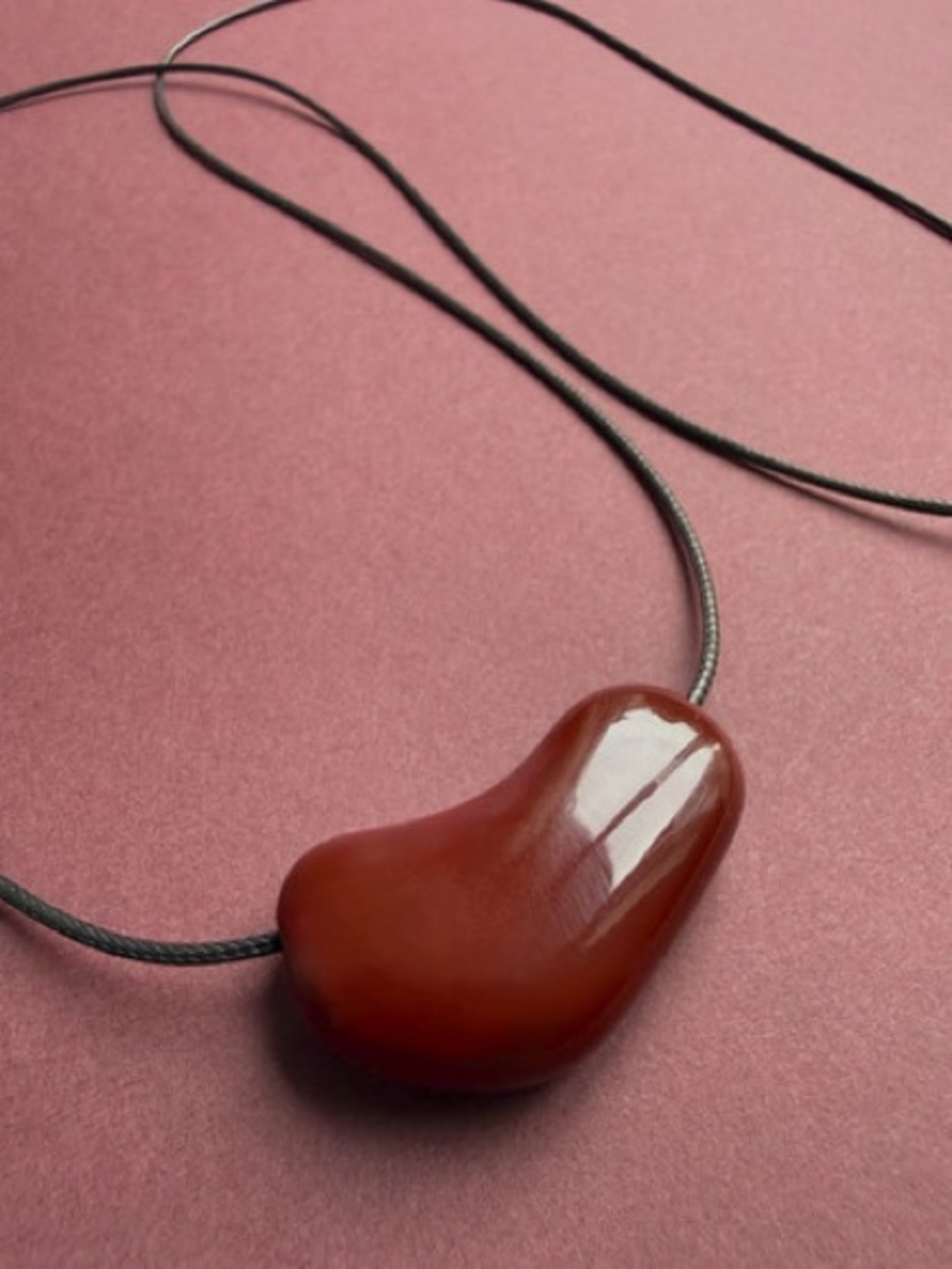 Burgundy Red Sculptural Bean Pendant Necklace Black Cord Modern Minimalist